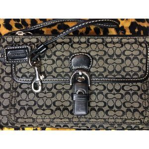 96. Authentic Coach Soho Black Mini Signature Buckle Wristlet silver tone